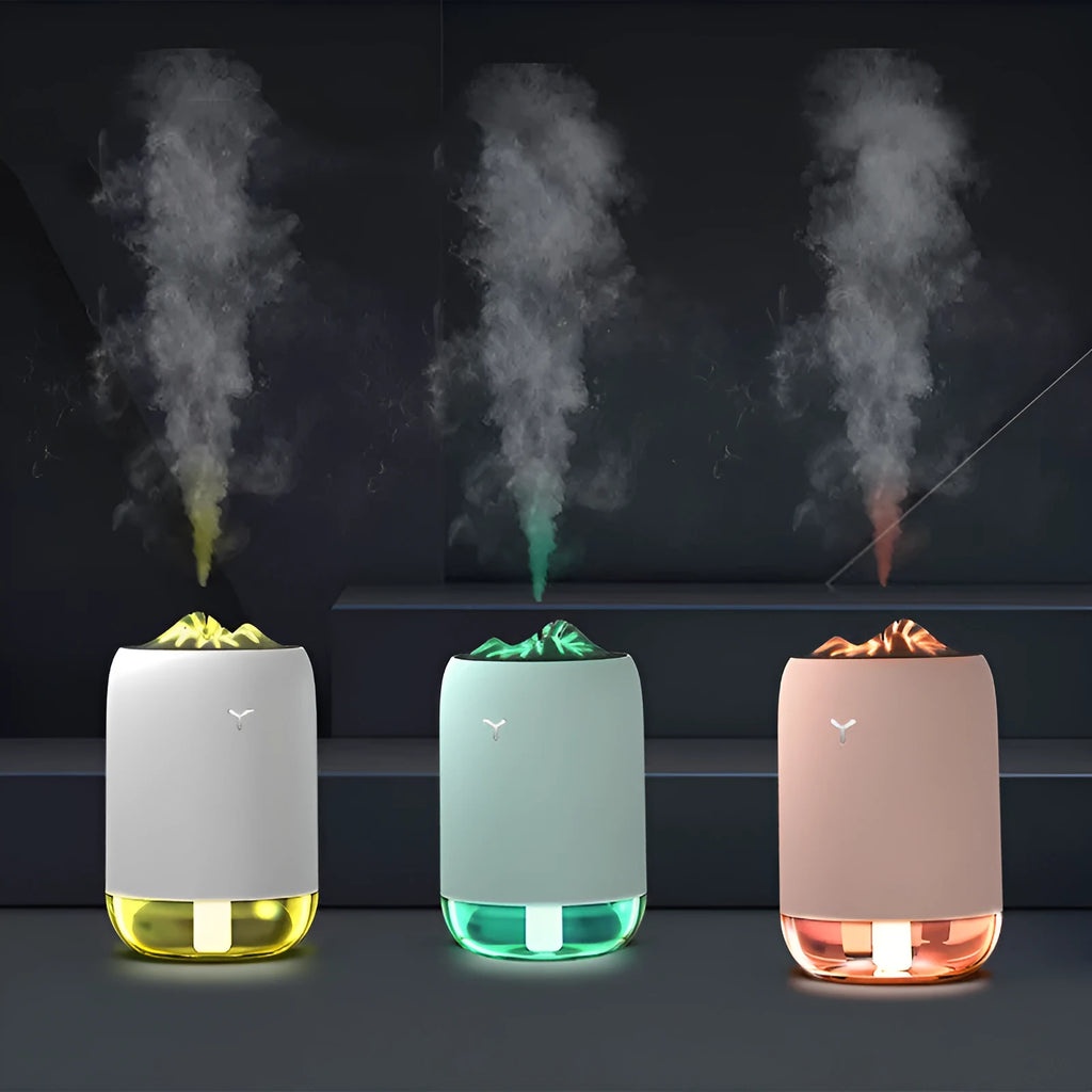 Magic Flame columnar USB humidifier in light blue, pink, or white colours for desktop use