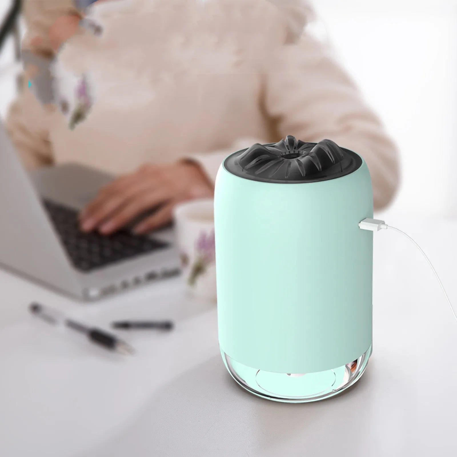 Magic Flame columnar USB humidifier in light blue, pink, or white colours for desktop use