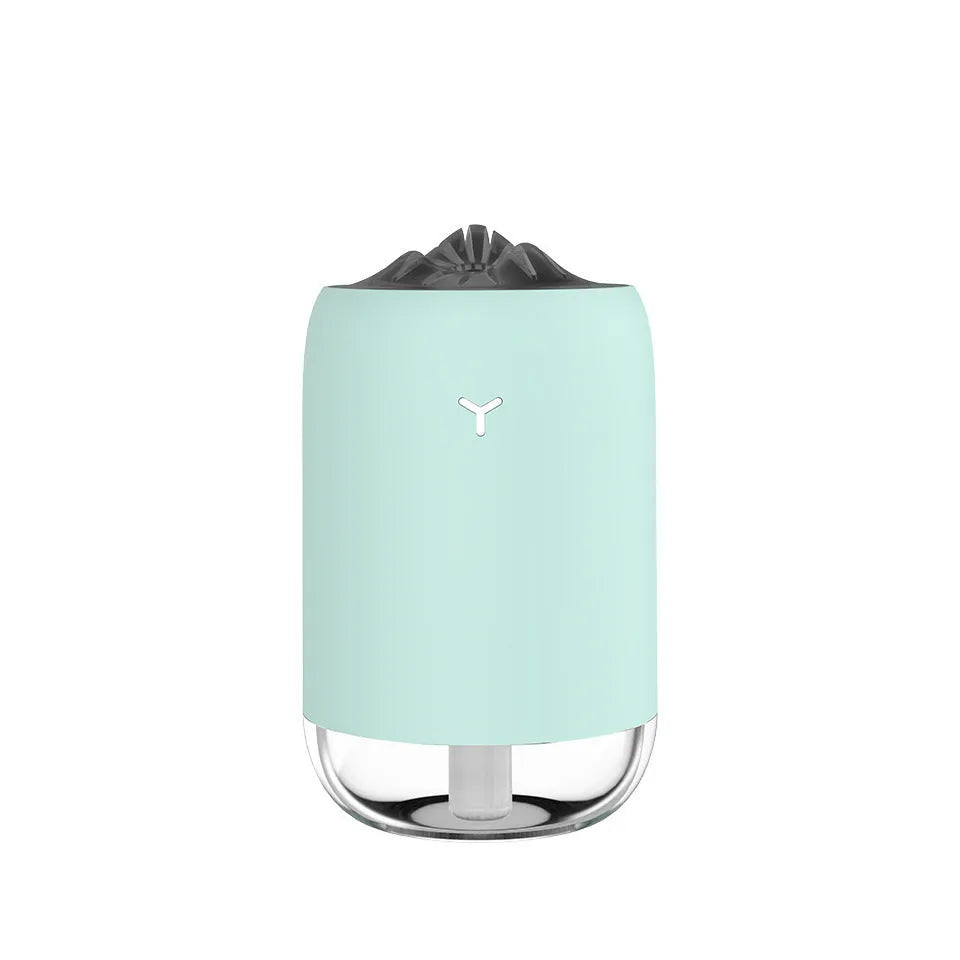 Magic Flame columnar USB humidifier in light blue, pink, or white colours for desktop use
