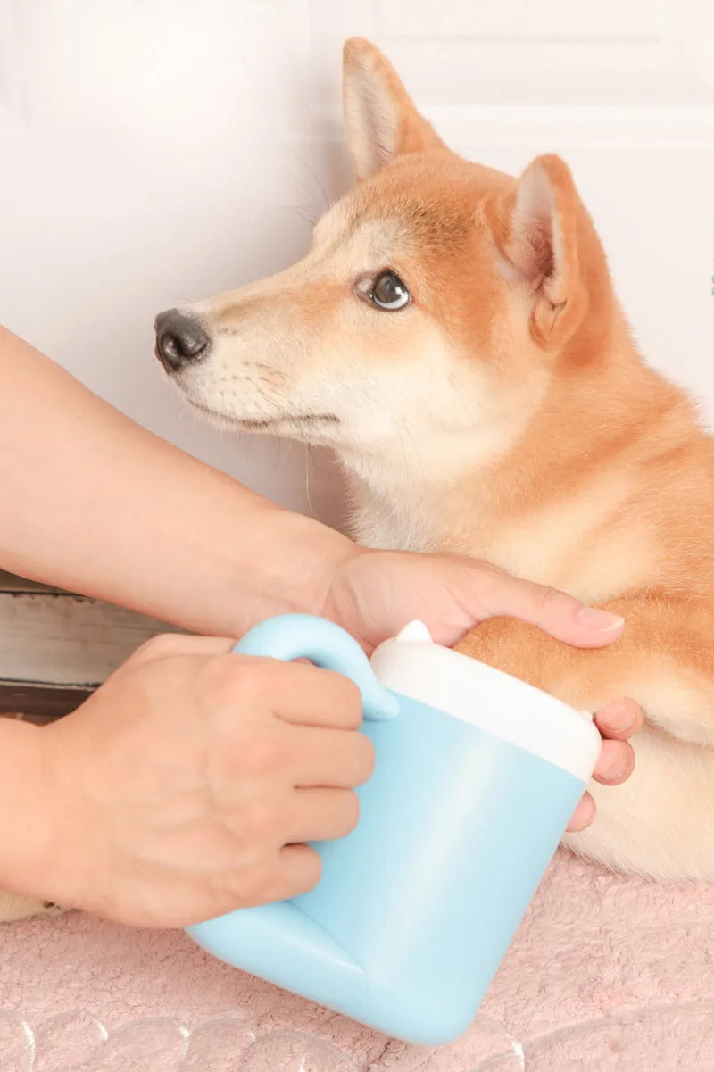 Pink pet paw cleaning cup with silicone brush and handle