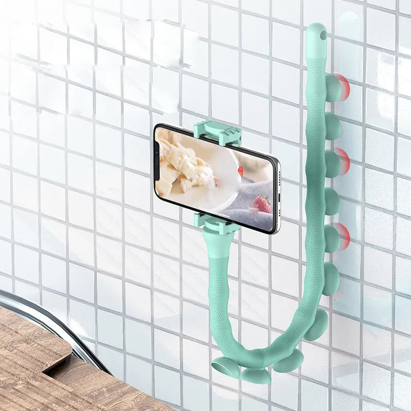 Flexible rubber phone holder with suction cup wrapped around bicycle handlebar