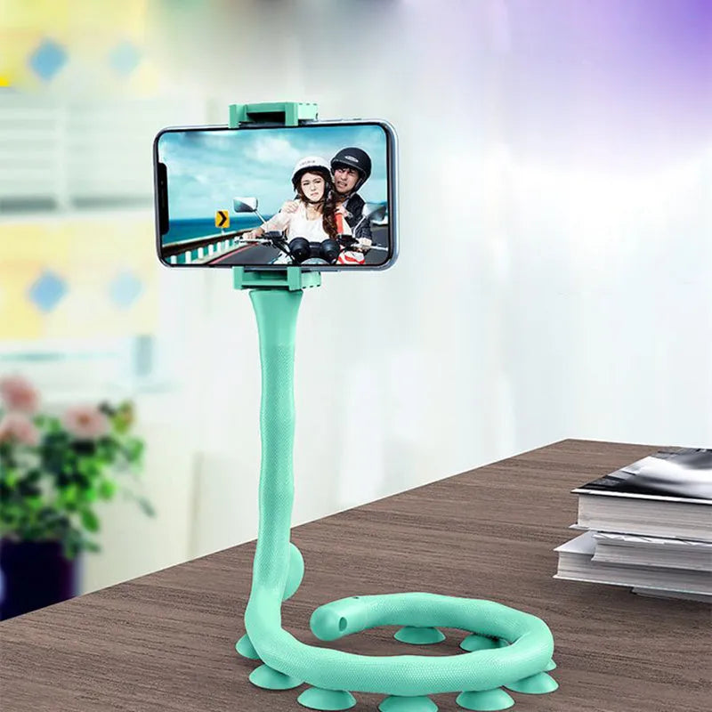 Flexible rubber phone holder with suction cup wrapped around bicycle handlebar