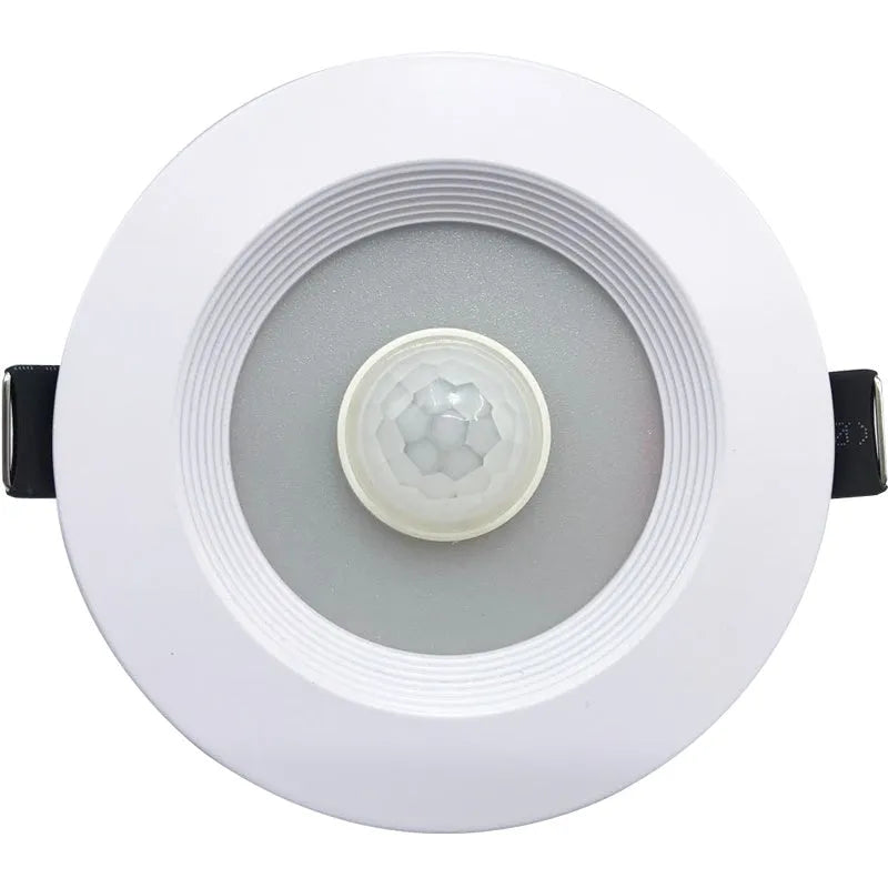 Aluminium infrared body sensing LED downlight with white light, shown in a ceiling recess.