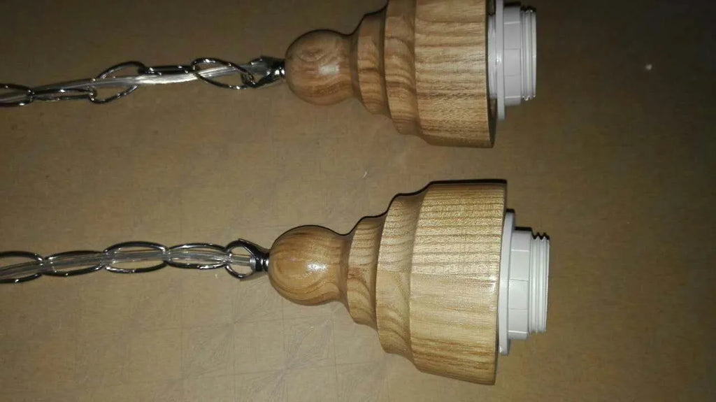 Nordic style single head pendant light with wood grain glass shade on adjustable cable.