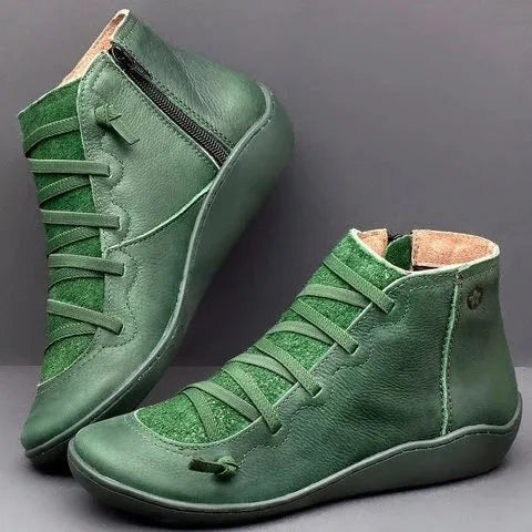 Women's casual flat boots with a wedge heel and round toe in various colours.