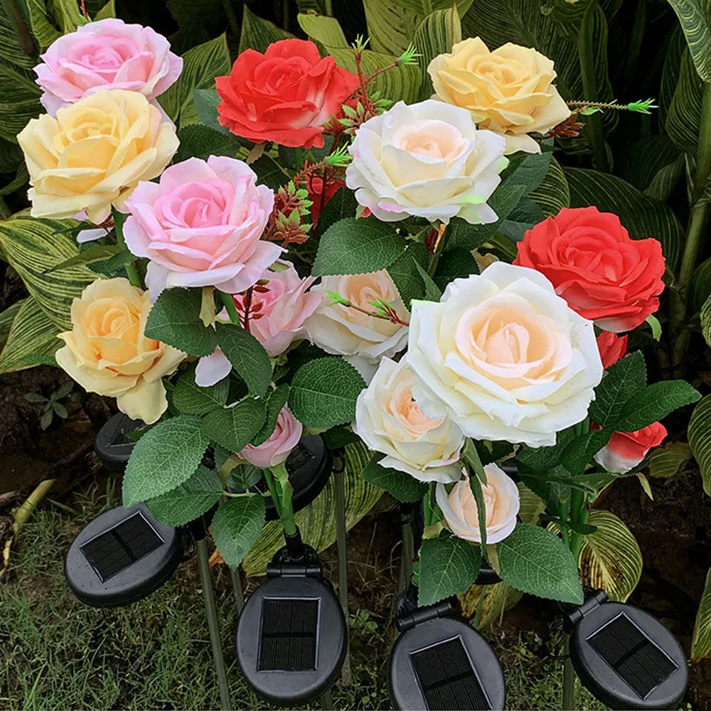 Outdoor solar rose lawn lamp with three rose heads, ground spike installation, and silk cloth petals