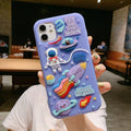 Purple silicone iPhone case with a detailed cartoon astronaut design on the back.