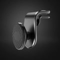 Black universal car phone holder bracket mounted on a car dashboard holding a smartphone.