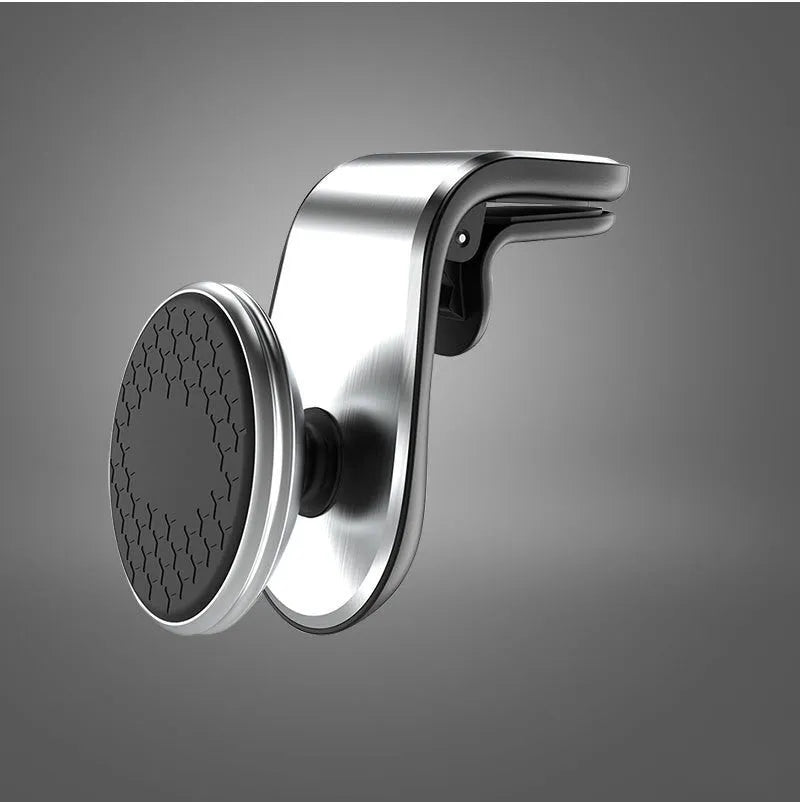 Black universal car phone holder bracket mounted on a car dashboard holding a smartphone.