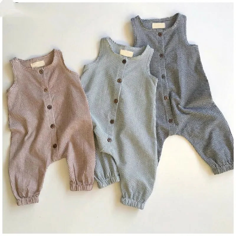 Black baby romper with lid buckle closure and sleeveless cotton design for newborns
