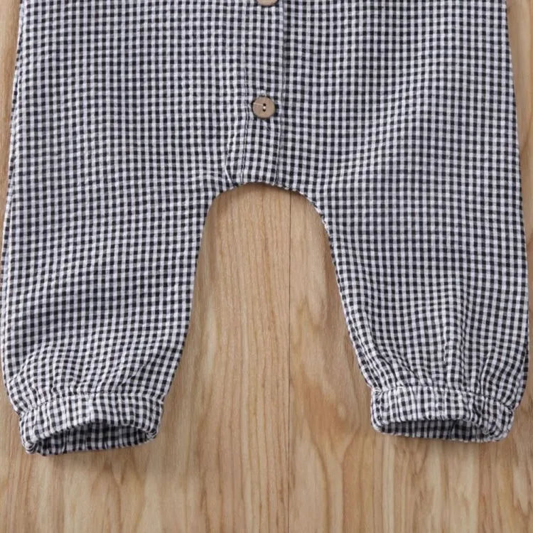 Black baby romper with lid buckle closure and sleeveless cotton design for newborns