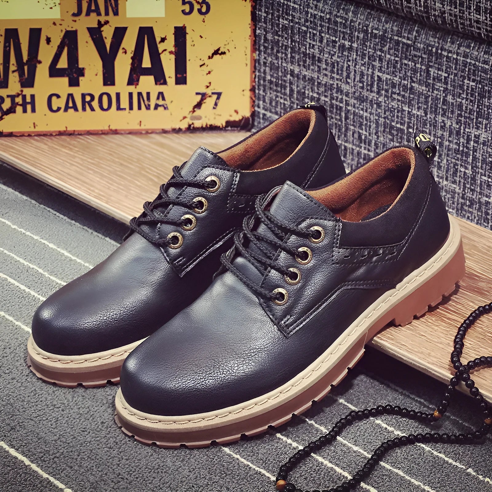 Men's brown round-toe casual shoes with front-tie laces and a low-profile rubber sole on a plain background.