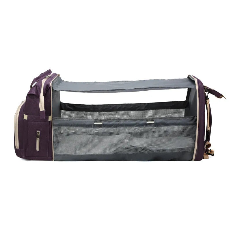 Portable folding crib mummy bag in Oxford cloth with 36-55L capacity, zipper opening, and internal phone, ID, and computer pockets