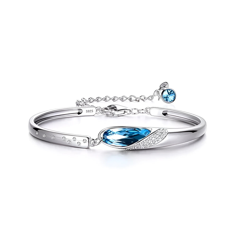 Silver-plated heart pendant necklace with blue crystal zircon inlay on display