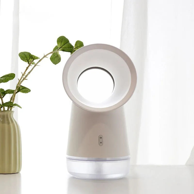 White desktop humidifier with leafless fan and 300ML water tank on a desk, emitting cool mist from single fog outlet