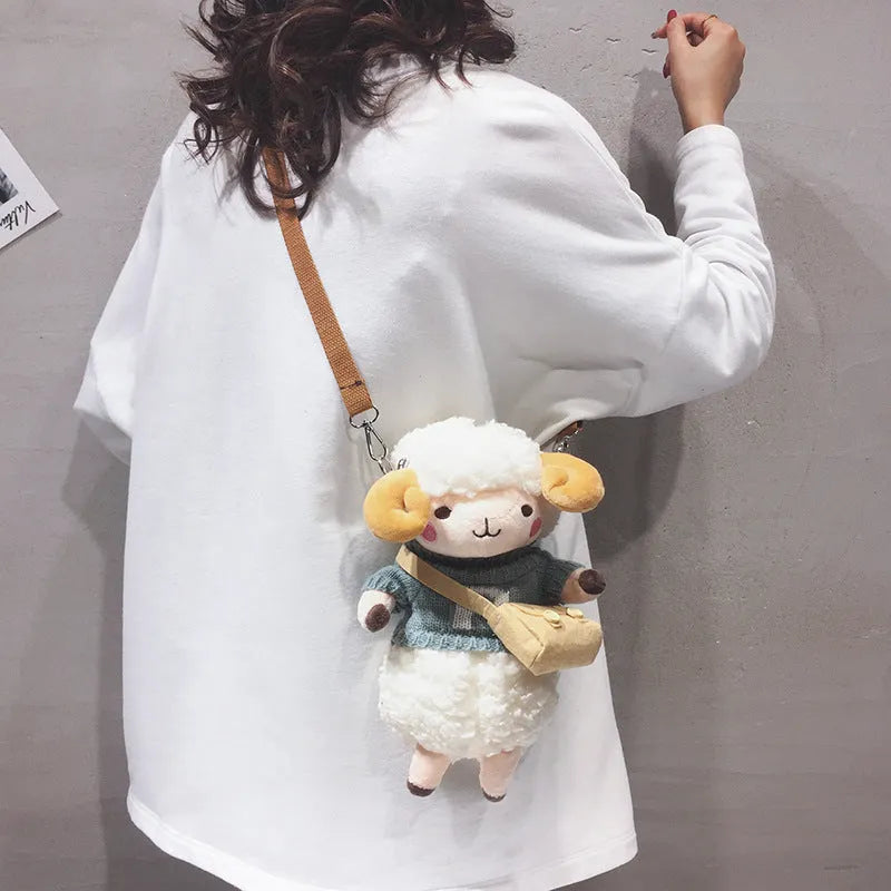 Little Sheep plush crossbody bag with lamb pattern in blue colour, showing zipper closure and square shape