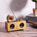 Home wireless horn flower Bluetooth speaker in dark wood finish with front grille and control buttons