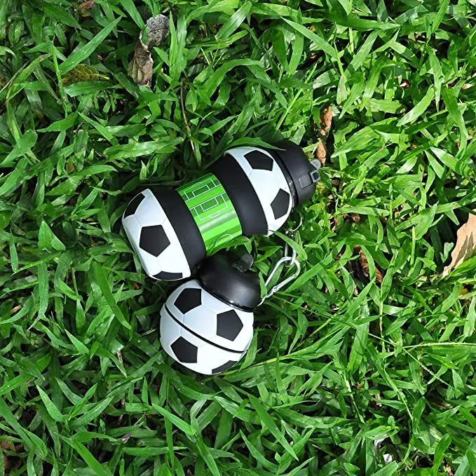 White collapsible silicone soccer water bottle with straw and carrying clip on white background