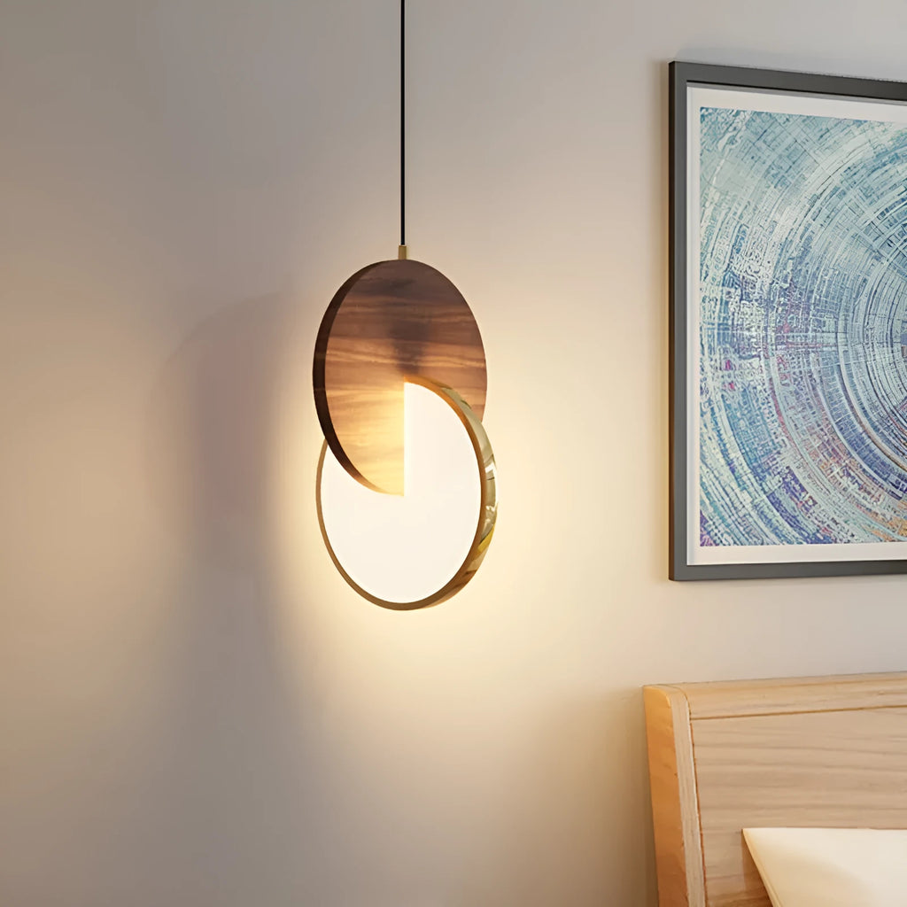 Long-line modern chandelier made from carved solid walnut wood, mounted on a wall, emitting warm white light.