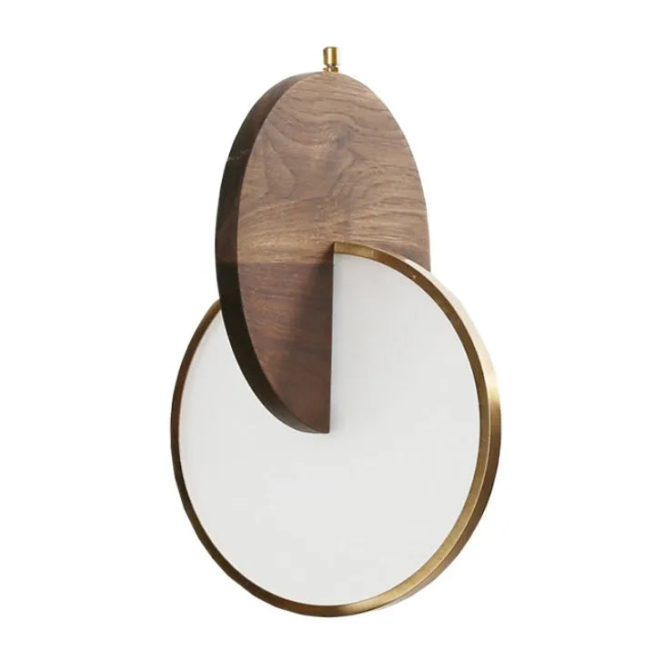 Long-line modern chandelier made from carved solid walnut wood, mounted on a wall, emitting warm white light.