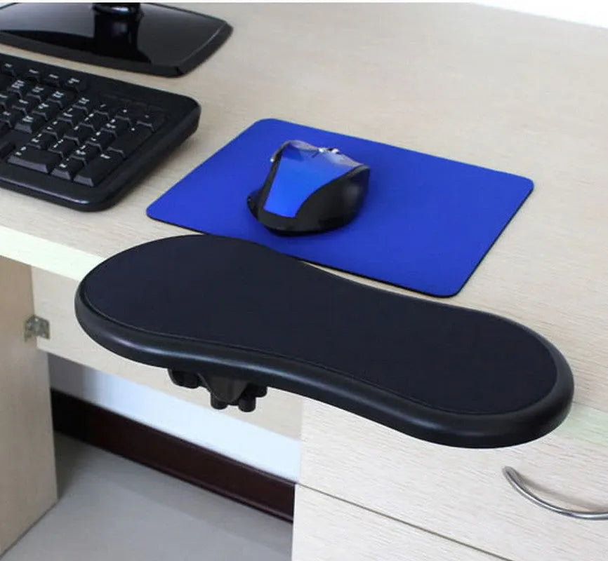 Black plastic rotating computer hand bracket wrist pad showing 180-degree adjustment on a desk.