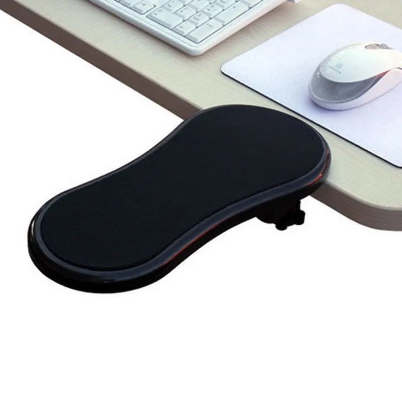 Black plastic rotating computer hand bracket wrist pad showing 180-degree adjustment on a desk.
