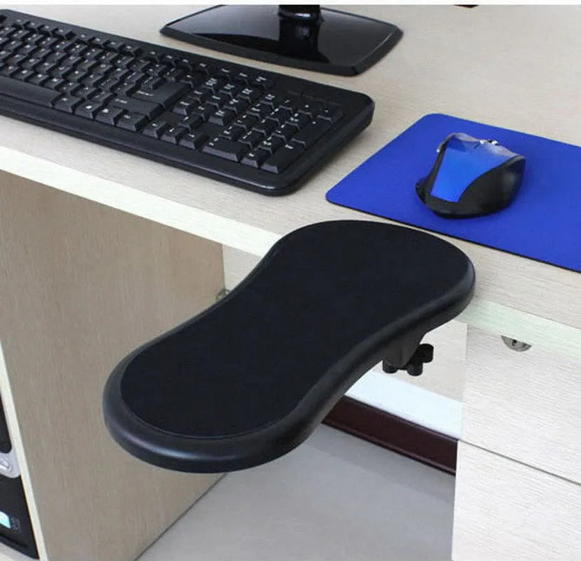 Black plastic rotating computer hand bracket wrist pad showing 180-degree adjustment on a desk.