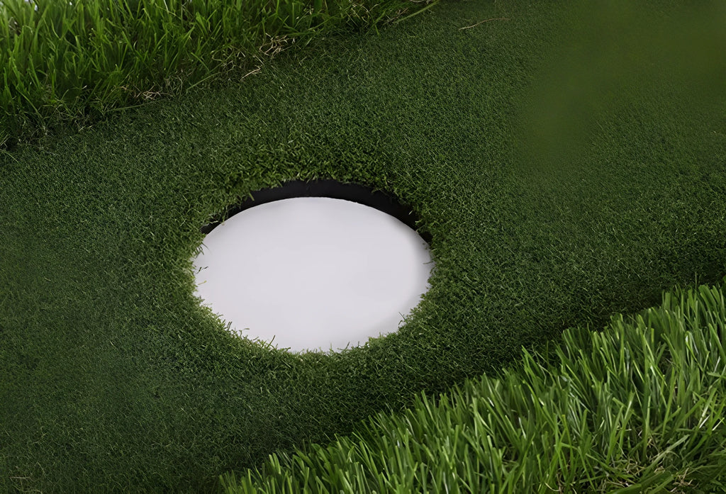 Green golf training mat on flat surface showing polypropylene grass texture and EVA foam base