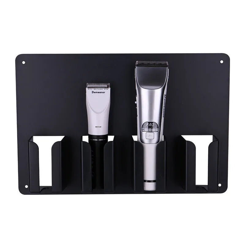 Black plastic wall-mounted storage rack holding four electric hair clippers for salon or home organisation