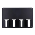 Black plastic wall-mounted storage rack holding four electric hair clippers for salon or home organisation