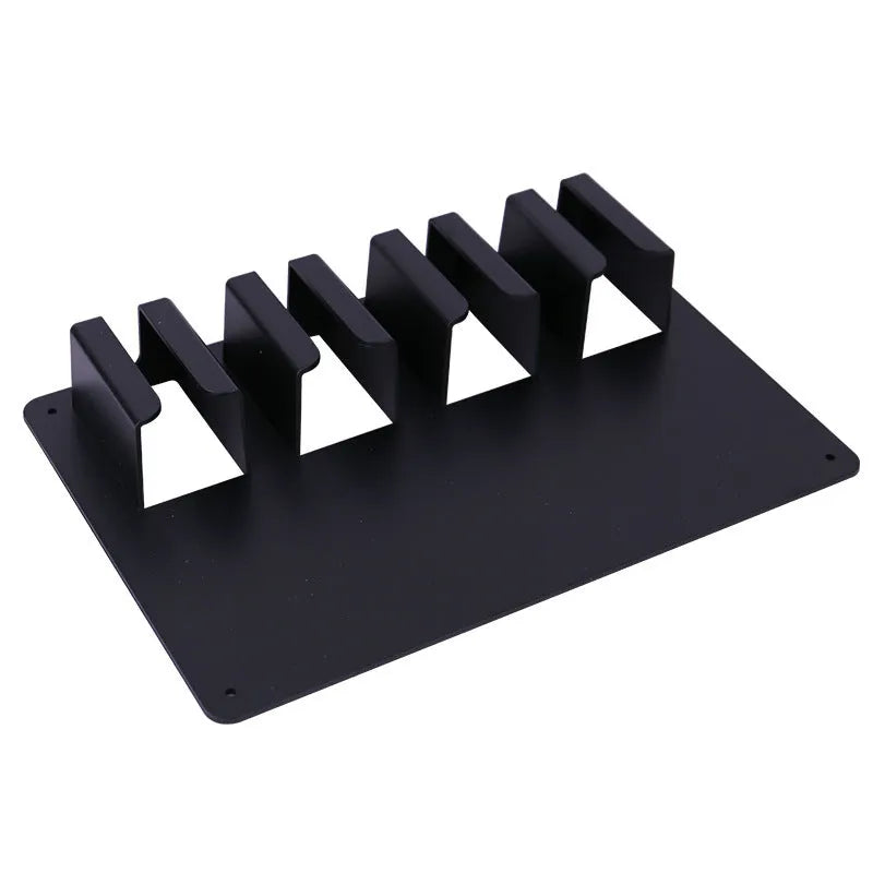 Black plastic wall-mounted storage rack holding four electric hair clippers for salon or home organisation