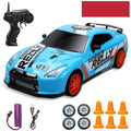 Huangbo red 4WD remote control drift car on a surface showing its size and design.