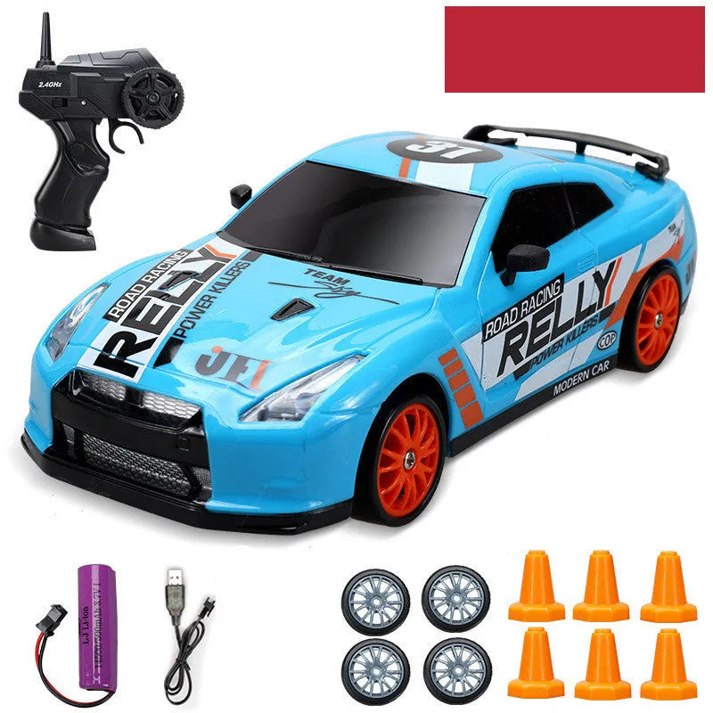 Huangbo red 4WD remote control drift car on a surface showing its size and design.