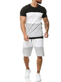 Cotton blended short sleeve round neck men's sports leisure suit in blue with plain design, shown front view.