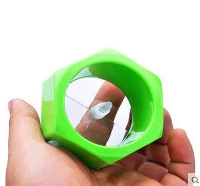 Yellow and green plastic spiral vegetable cutter for slicing cucumber, 8cm in diameter.