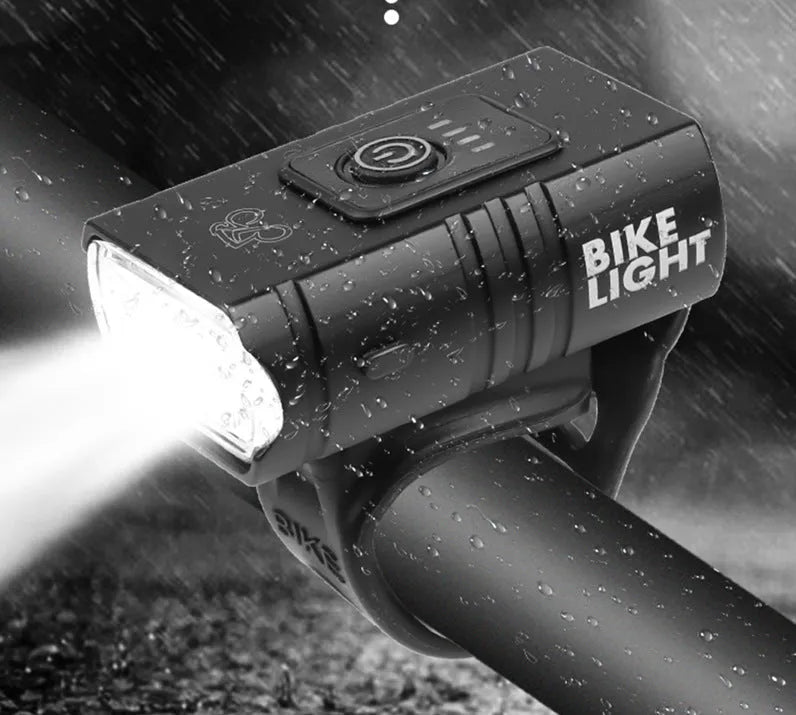 Outdoor cycling headlight with small double lamp design, T6 LED, 1600lm output, and red warning light on handlebar