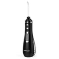 V500 portable electric dental flusher in white with black carrying case on bathroom counter