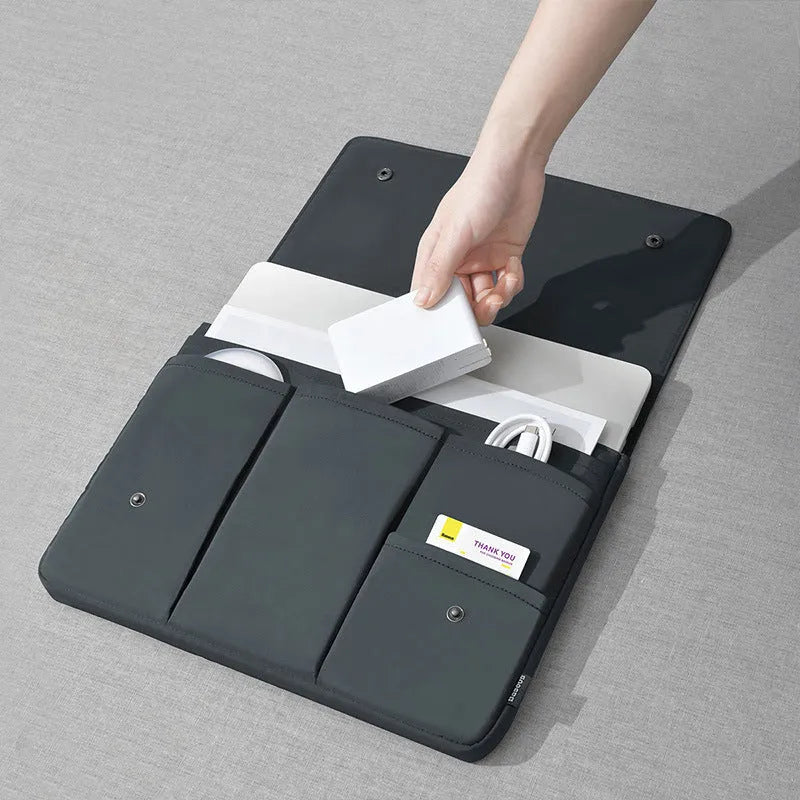 Black nylon notebook liner bag with magnetic buckle and internal pockets for 13-inch laptop