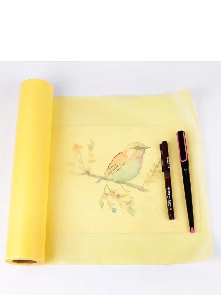Aikale sketch scroll paper roll in white or yellow, showing width options of 30.5cm and 46cm on a wooden desk