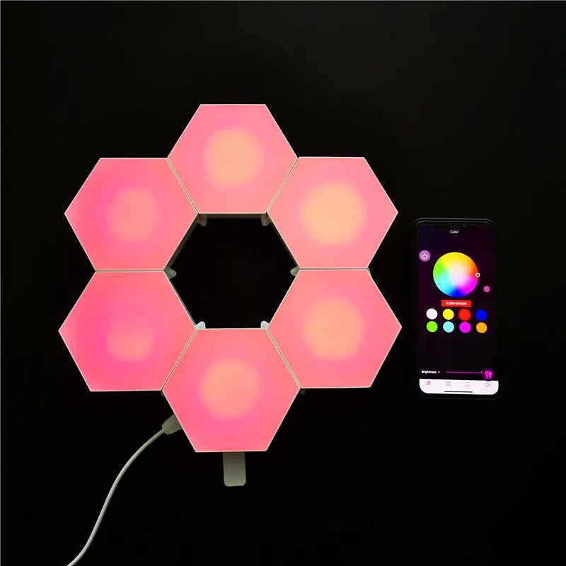 Close up of a modular hexagon LED wall light in a honeycomb pattern with multiple colour panels
