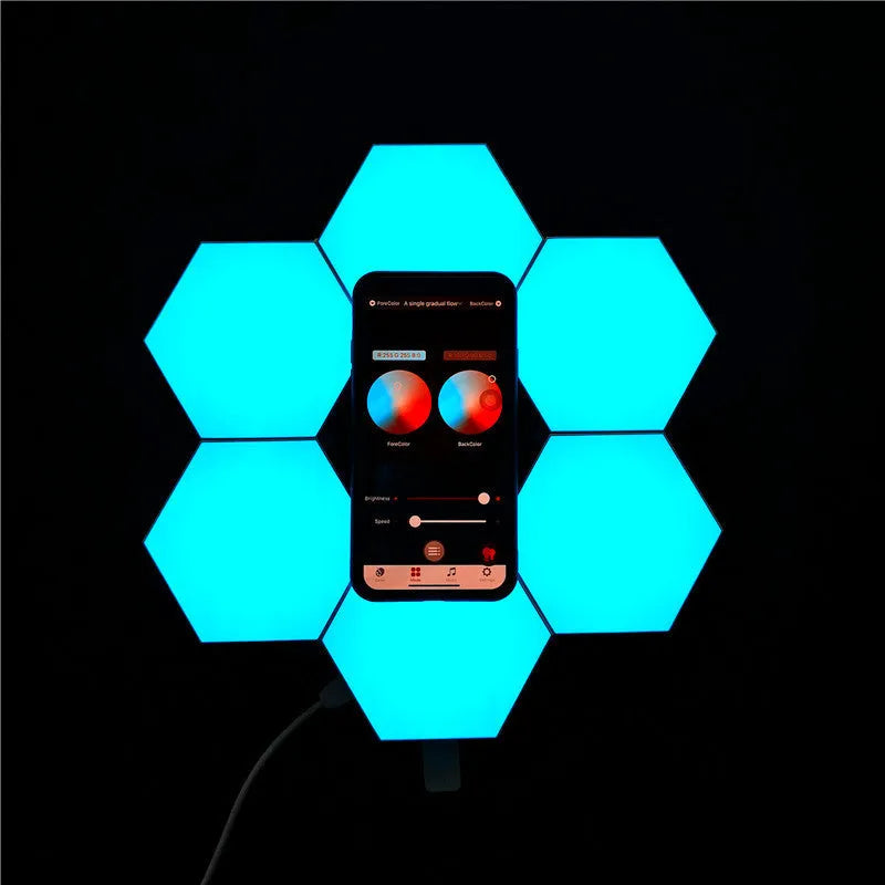 Close up of a modular hexagon LED wall light in a honeycomb pattern with multiple colour panels