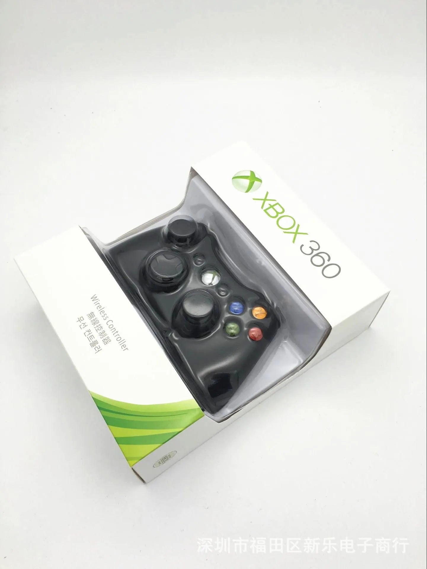 Xbox 360 wireless controller in black with thumbsticks, D-pad, and Xbox navigation button on white background