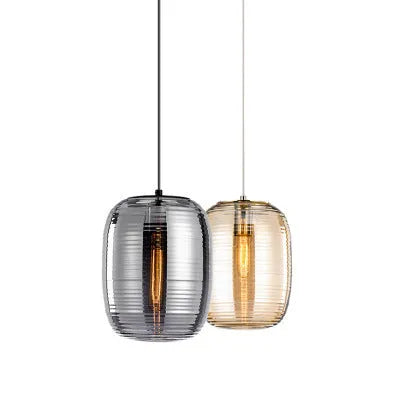 Simple Nordic style glass table lamp and matching chandelier in cognac and smoky grey colours.