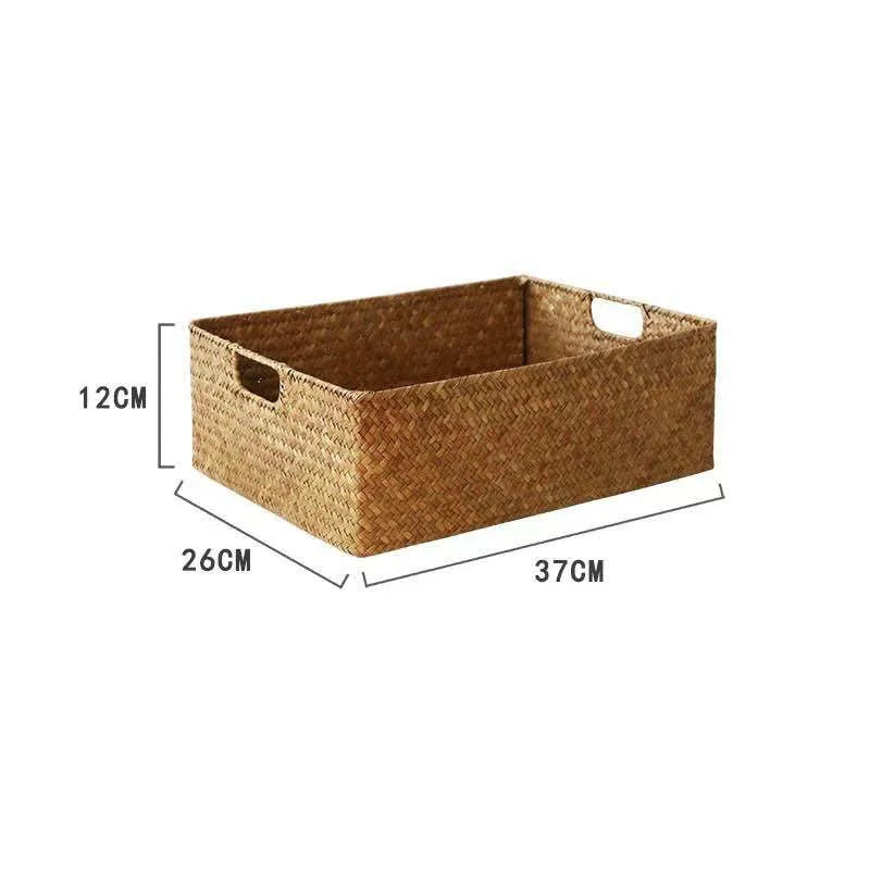 Handwoven grass rectangular storage baskets in various sizes on a wooden shelf