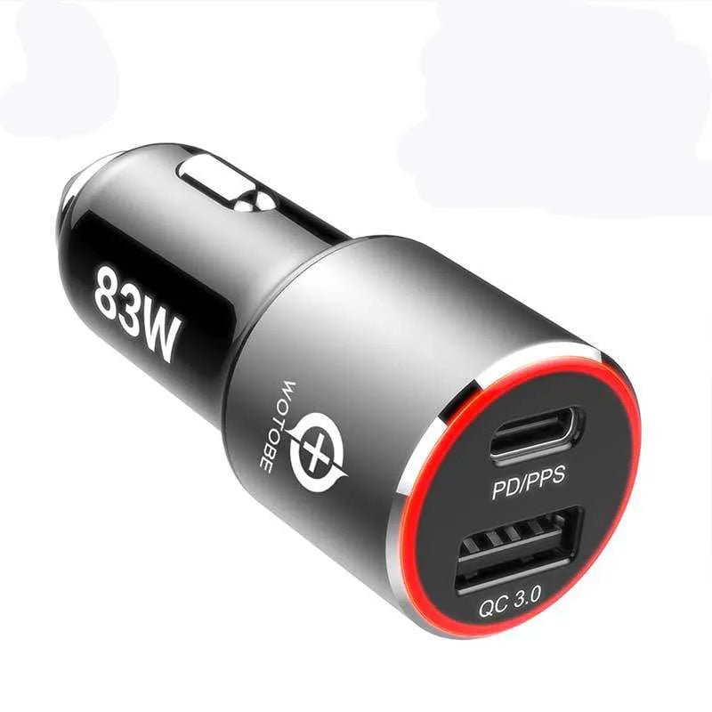 Compact dual-port 83W fast car charger plugged into a vehicle's 12V socket with USB-C and USB-A cables connected.