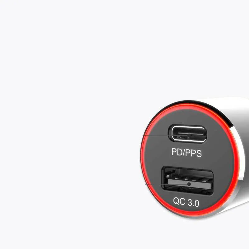 Compact dual-port 83W fast car charger plugged into a vehicle's 12V socket with USB-C and USB-A cables connected.