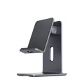 Dark Space Gray aluminium alloy adjustable lazy bracket phone holder clamped to a desk edge, holding a mobile phone.