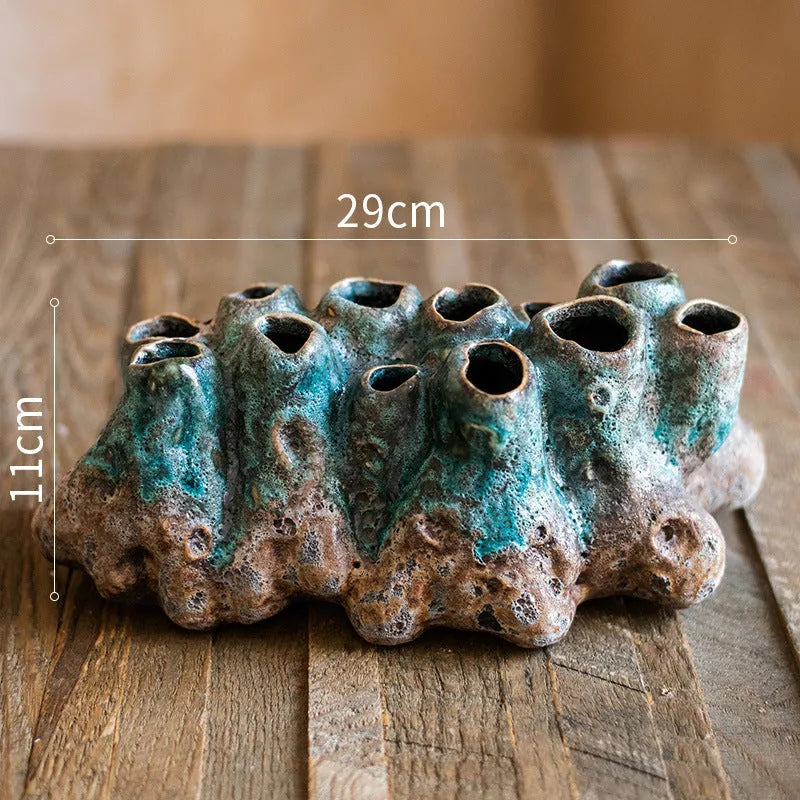 Medium ceramic barnacle vase with porous textured surface in new Chinese style