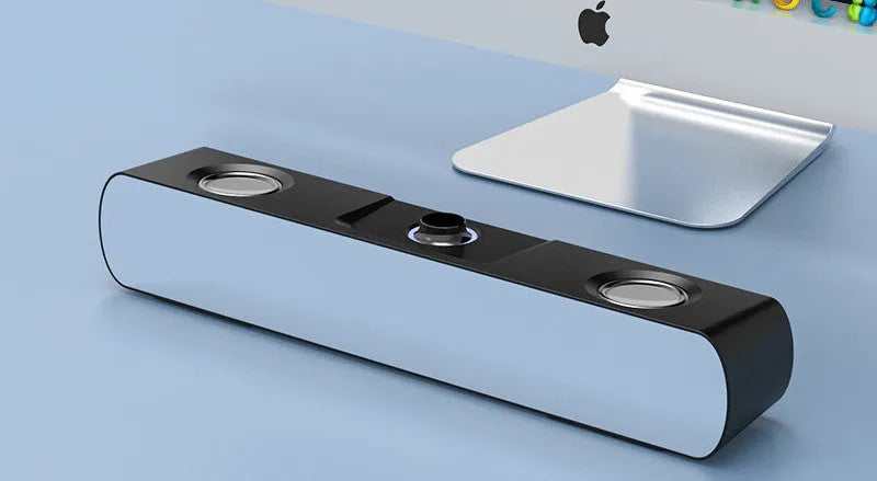 Small black desktop computer speaker with mirror finish and Bluetooth connectivity