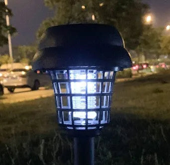 Solar mosquito killer lamp with white light and purple insecticidal glow for outdoor use